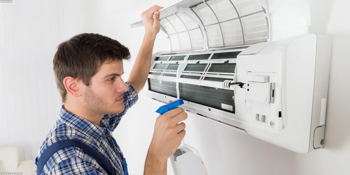 Appliance repair technician at work